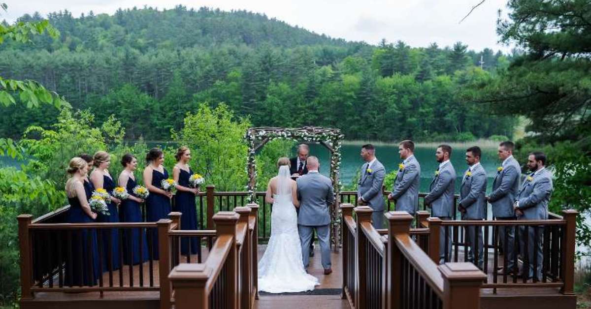 couple getting married on a deck outside in summer