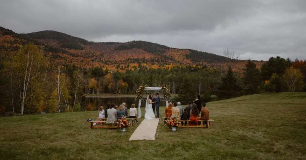 couple getting married outdoors on a fall day 