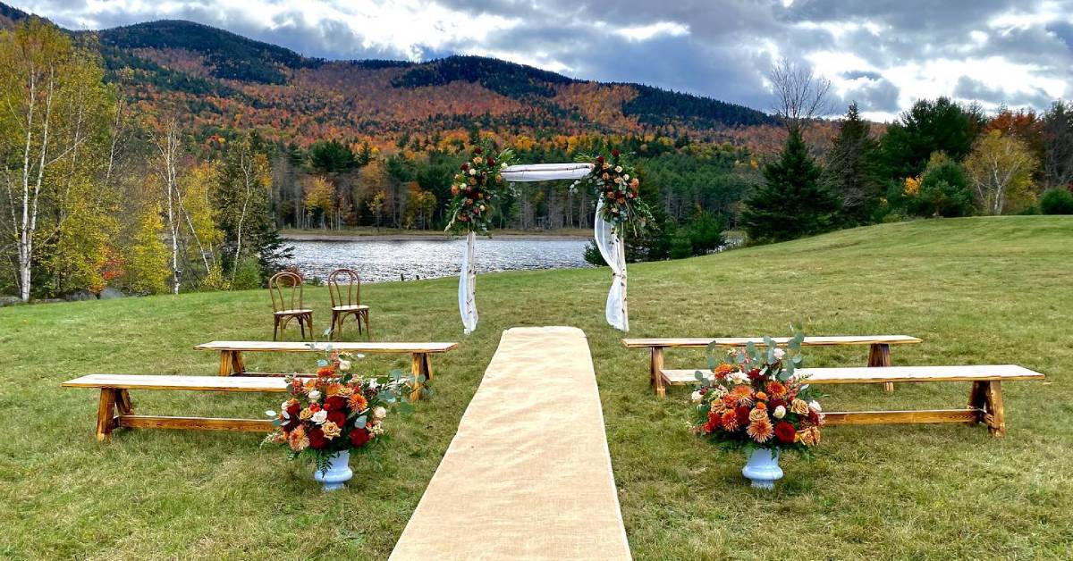 fall wedding setup by lake